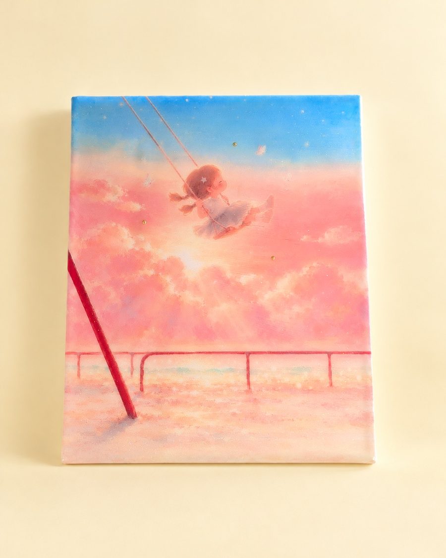 仕上がった作品:夕焼けの空でブランコをこぐ女の子のキャンバス